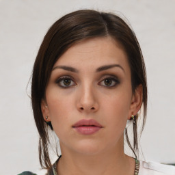 Neutral white young-adult female with medium  brown hair and brown eyes