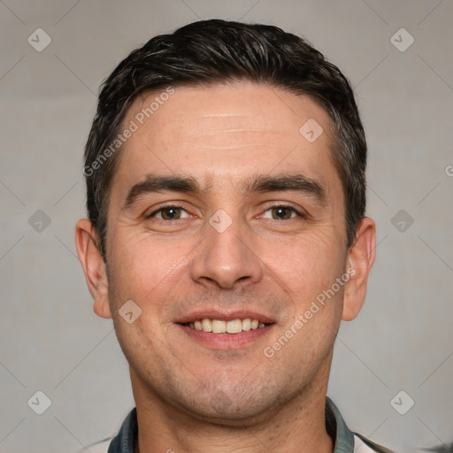 Joyful white young-adult male with short  black hair and brown eyes