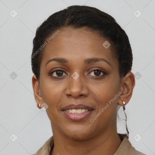 Joyful black young-adult female with short  brown hair and brown eyes