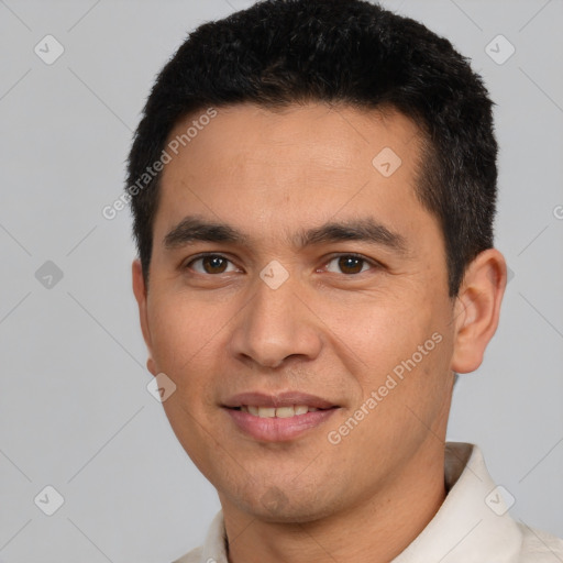 Joyful white young-adult male with short  black hair and brown eyes