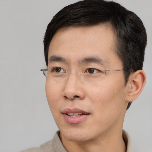 Neutral asian adult male with short  brown hair and brown eyes