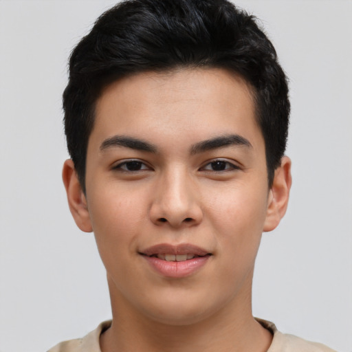 Joyful asian young-adult male with short  brown hair and brown eyes