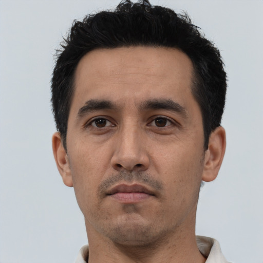 Neutral latino young-adult male with short  black hair and brown eyes