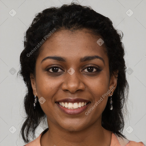 Joyful black young-adult female with long  brown hair and brown eyes