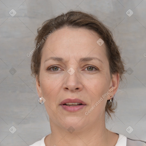 Joyful white adult female with short  brown hair and brown eyes