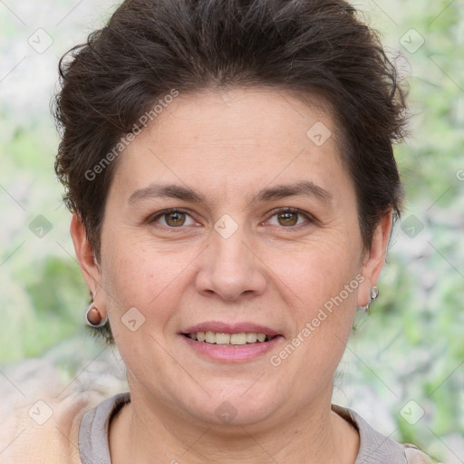 Joyful white adult female with short  brown hair and brown eyes