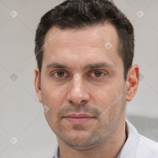 Joyful white adult male with short  brown hair and brown eyes