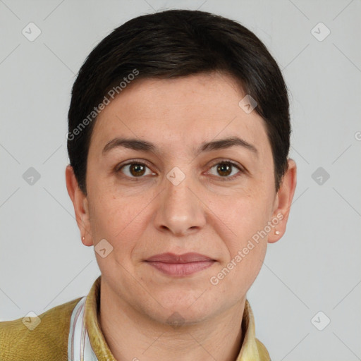 Joyful white adult female with short  brown hair and brown eyes