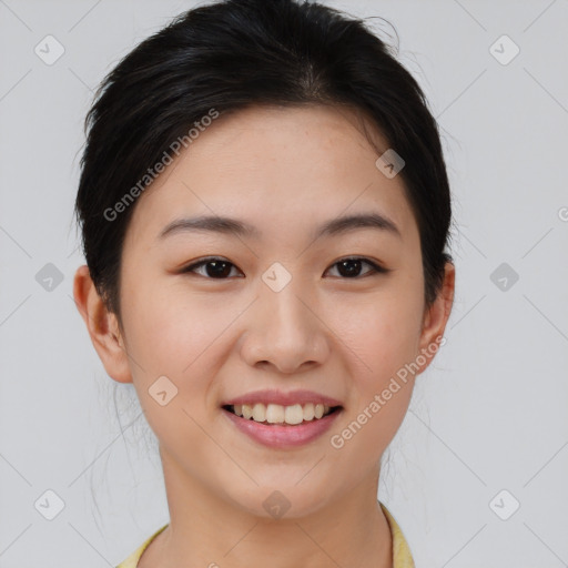 Joyful asian young-adult female with short  brown hair and brown eyes