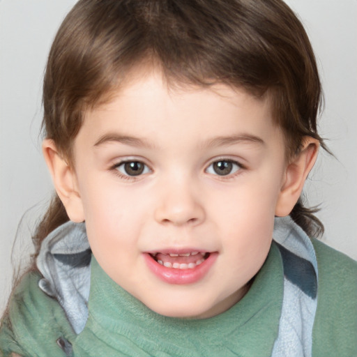 Joyful white child male with medium  brown hair and brown eyes