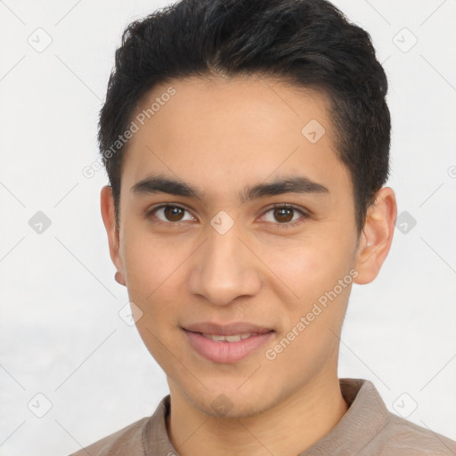 Joyful latino young-adult male with short  brown hair and brown eyes