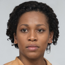 Neutral black young-adult female with short  brown hair and brown eyes