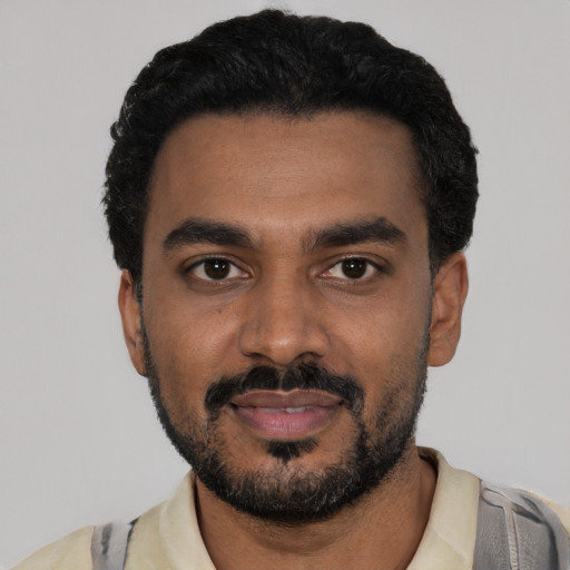 Neutral black young-adult male with short  black hair and brown eyes