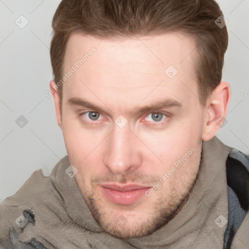 Joyful white adult male with short  brown hair and grey eyes