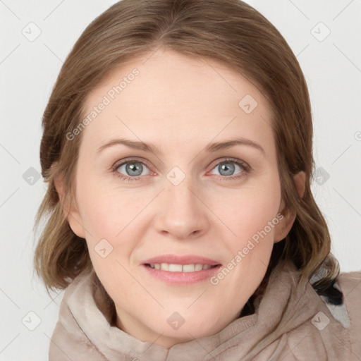 Joyful white young-adult female with medium  brown hair and blue eyes