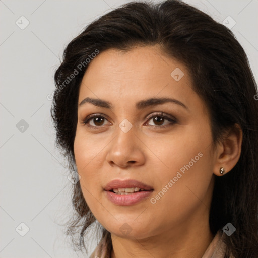 Joyful latino young-adult female with long  brown hair and brown eyes