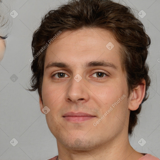 Joyful white young-adult male with medium  brown hair and brown eyes