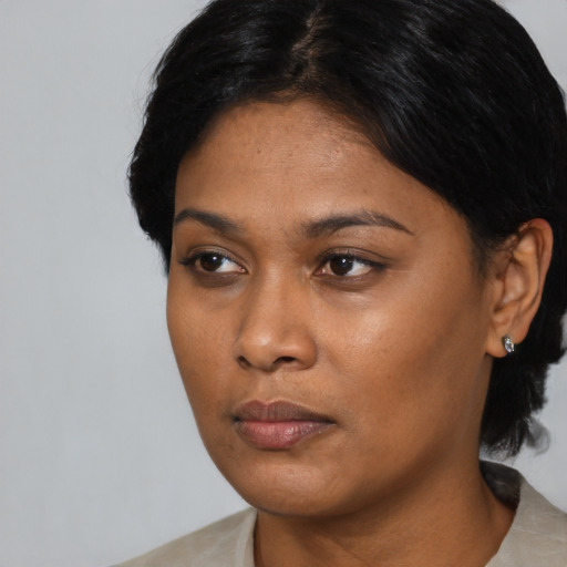 Neutral asian young-adult female with short  black hair and brown eyes