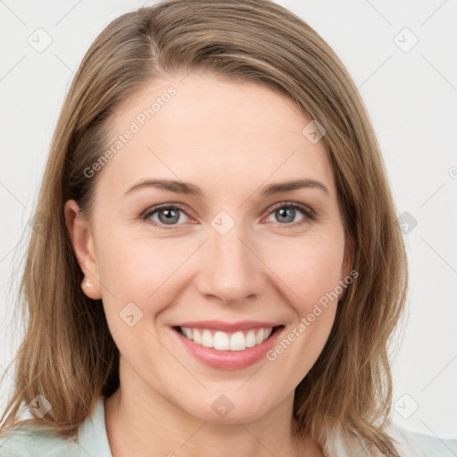 Joyful white young-adult female with medium  brown hair and green eyes