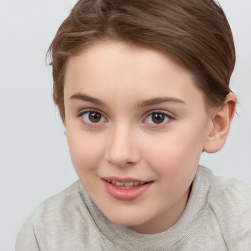 Joyful white child female with short  brown hair and brown eyes