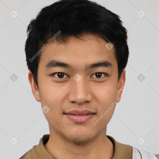 Joyful asian young-adult male with short  black hair and brown eyes