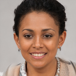 Joyful latino young-adult female with short  brown hair and brown eyes