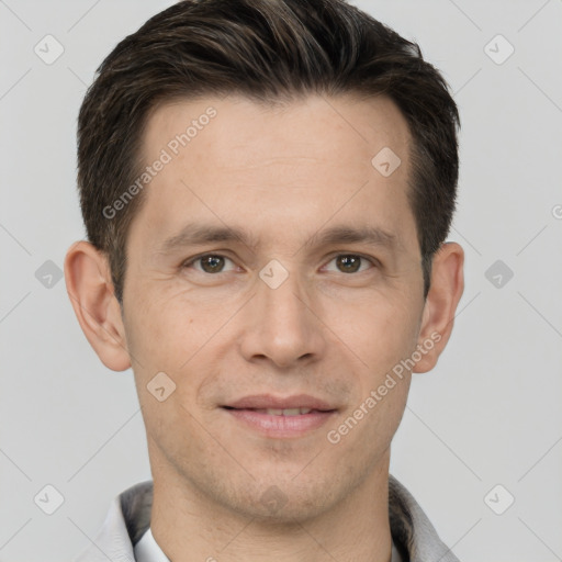 Joyful white adult male with short  brown hair and grey eyes