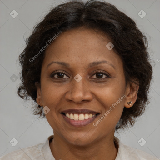 Joyful latino adult female with medium  brown hair and brown eyes