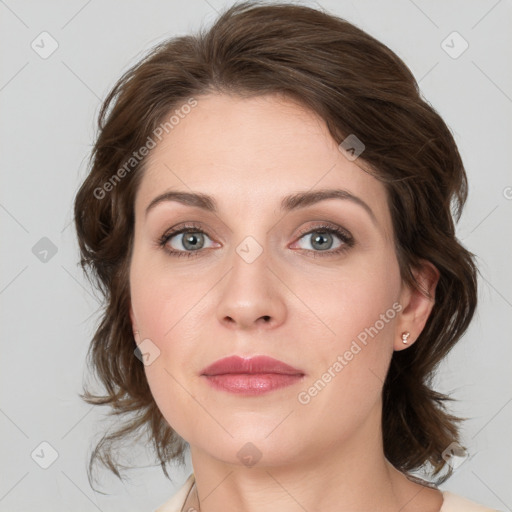 Joyful white young-adult female with medium  brown hair and blue eyes