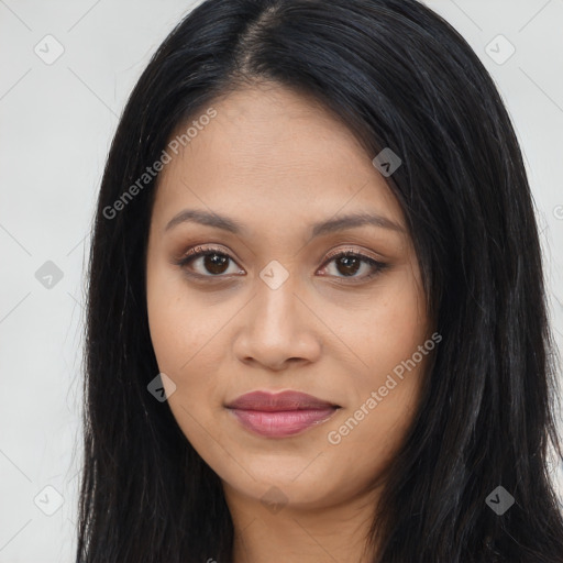 Joyful latino young-adult female with long  black hair and brown eyes