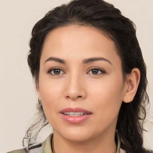 Joyful white young-adult female with long  brown hair and brown eyes