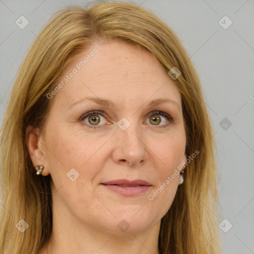 Joyful white adult female with long  brown hair and brown eyes