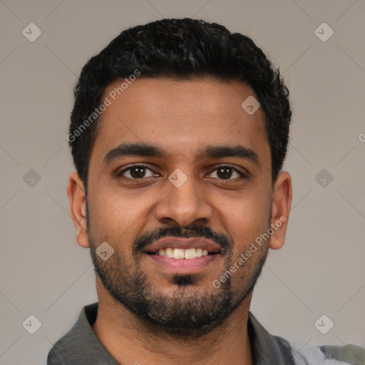 Joyful latino young-adult male with short  black hair and brown eyes