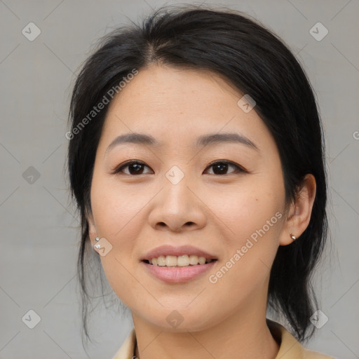 Joyful asian young-adult female with medium  black hair and brown eyes