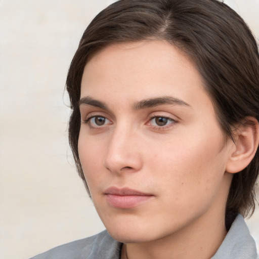 Neutral white young-adult female with medium  brown hair and brown eyes