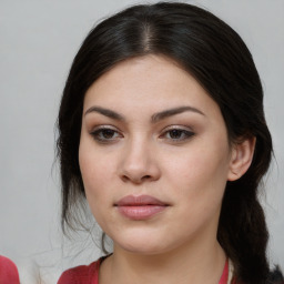 Joyful asian young-adult female with long  brown hair and brown eyes