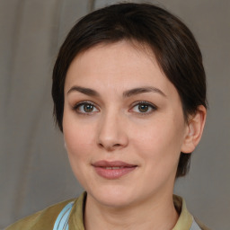 Joyful white young-adult female with medium  brown hair and brown eyes