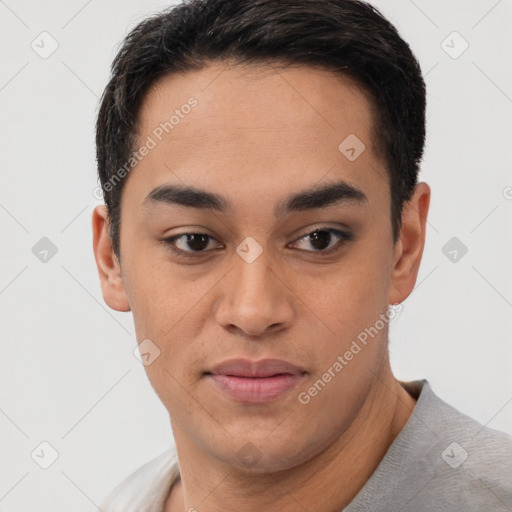 Joyful latino young-adult male with short  brown hair and brown eyes