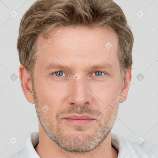 Joyful white adult male with short  brown hair and grey eyes