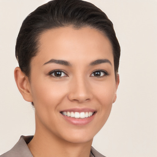 Joyful white young-adult female with short  black hair and brown eyes