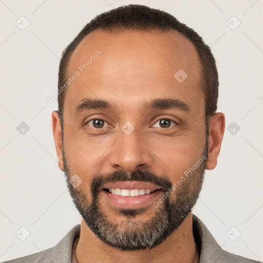 Joyful white young-adult male with short  black hair and brown eyes