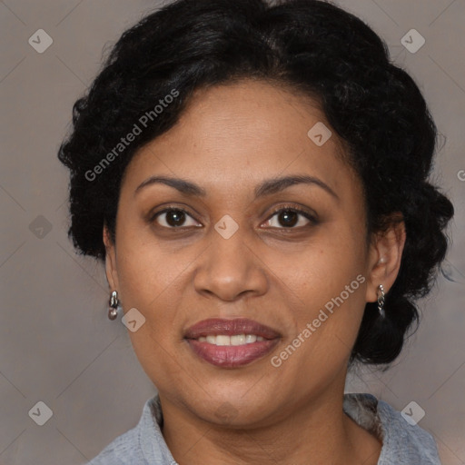 Joyful latino adult female with medium  brown hair and brown eyes