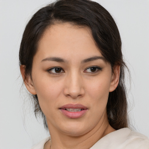 Joyful white young-adult female with medium  brown hair and brown eyes