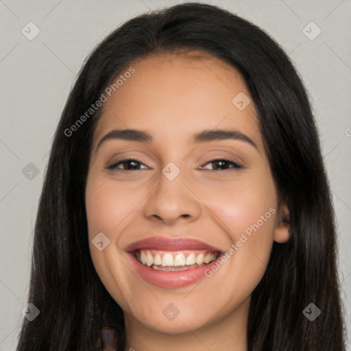 Joyful latino young-adult female with long  brown hair and brown eyes