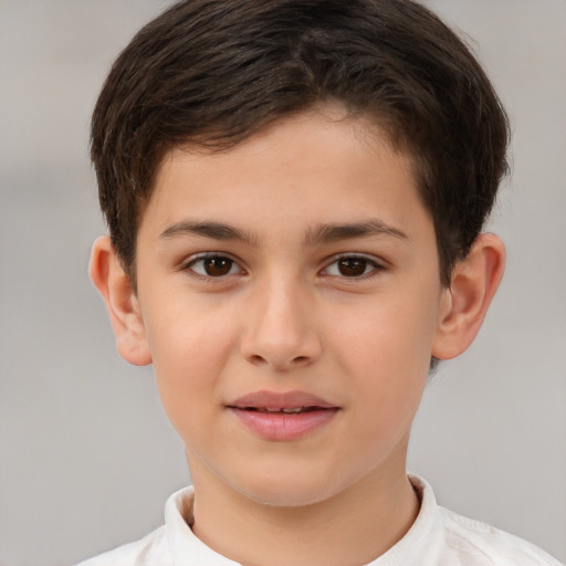 Joyful white child male with short  brown hair and brown eyes