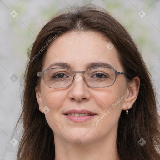 Joyful white adult female with long  brown hair and brown eyes