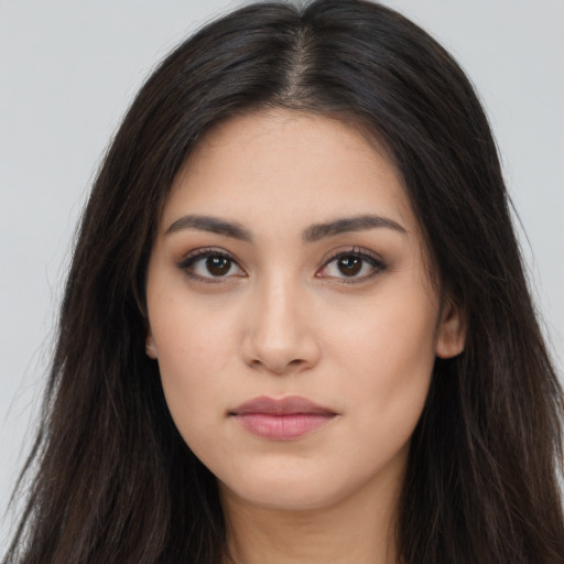 Neutral latino young-adult female with long  brown hair and brown eyes