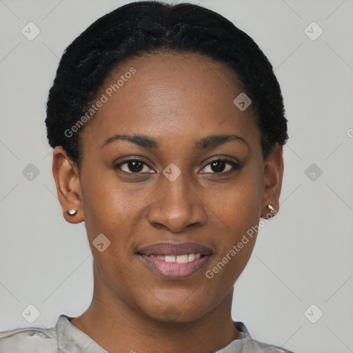 Joyful black young-adult female with short  black hair and brown eyes