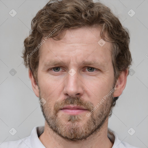 Neutral white adult male with short  brown hair and grey eyes