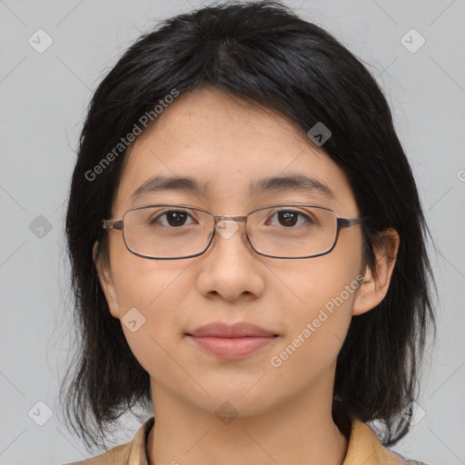 Joyful asian young-adult female with medium  brown hair and brown eyes